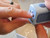 Image: Lil nipper electronic finger nail clipper, with finger inserted