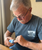 Image: Lil nipper electronic finger nail clipper, in use by a veteran