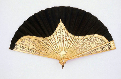 Antique hand fan in black and gold