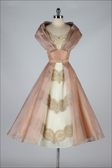 Rose Marie dress with elegant chiffon overlay and belted waist.