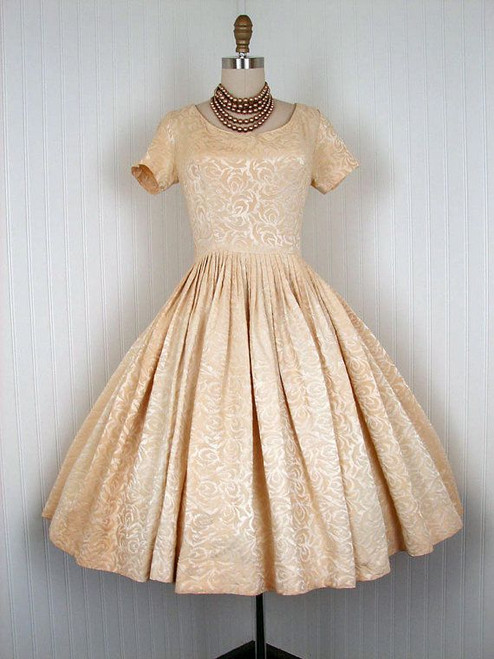 Peaches and Cream dress with scoop neckline and a wide flair skirt.