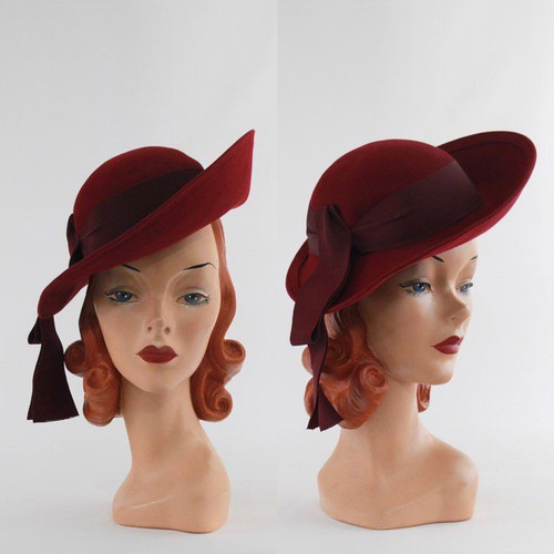 Beautiful vintage dark red hat with tassel detail.