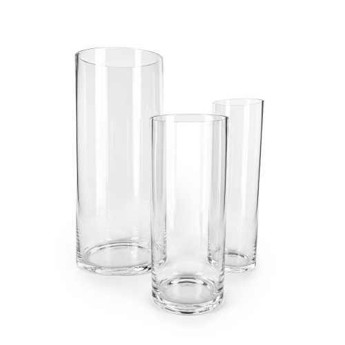 Set of three clear plastic vases.