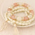 Golden Four-leaf Clover and Tassel Pendants Multi-layer Beads Fashion Bracelet - White A392-fabr1197