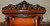 SOLD  Mahogany Herter Style Heavily Carved Etagere