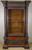 SOLD Antique Excessive Carved Multiple Bodies and Faces Walnut China Closet
