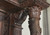 SOLD Antique Excessive Carved Multiple Bodies and Faces Walnut China Closet