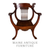 SOLD Antique Oak Lionhead Saddle Seat Arm Chair, 1900s