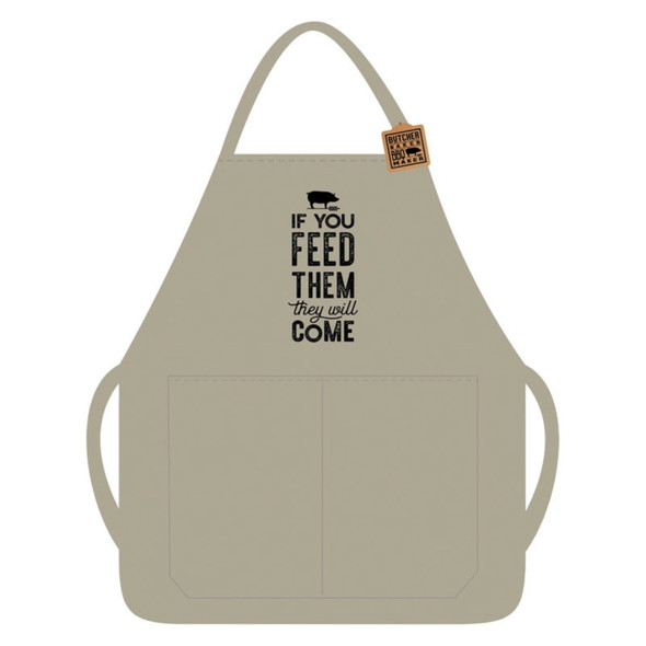A durable canvas BBQ apron with a fun and whimsical design. The apron features the phrase "If You Feed Them, They Will Come" in bold, playful lettering accompanied by a charming illustration of a pig. Its earthy tones give it a rustic, backyard BBQ vibe, perfect for grilling enthusiasts. The apron includes adjustable straps for a comfortable fit and a sturdy build to protect against spills and splatters. Ideal for use at the grill or in the kitchen, it combines practicality with humor, making it a standout accessory for any cookout or casual cooking session.