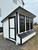 7x12 Modern Lean to chicken coop white with black trim