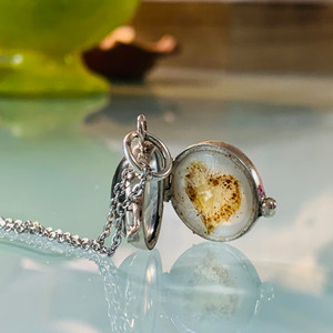 shown with a milk background layered with flower petals and umbilical cord shavings shown with a milk background layered with flower petals and umbilical cord shavings