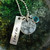 shown with stamped tag and birthstone charm