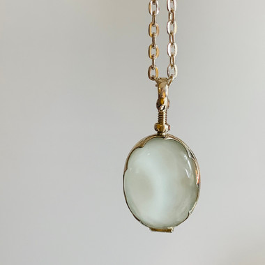 scalloped oval antique glass locket 