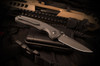 Spartan Blades Soter Blackout Edition folding knife, presentation side view with black CPM S35VN spear point blade and textured black G10 handle