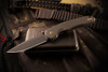 Spartan Blades Soter Carbon Ciber Edition folding knife, presentation side view with black CPM S35VN spear point blade and textured black G10 handle