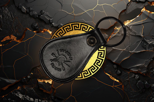 Spartan Blades black leather keychain with embossed Spartan helmet logo and stainless steel key ring, made in North Carolina.