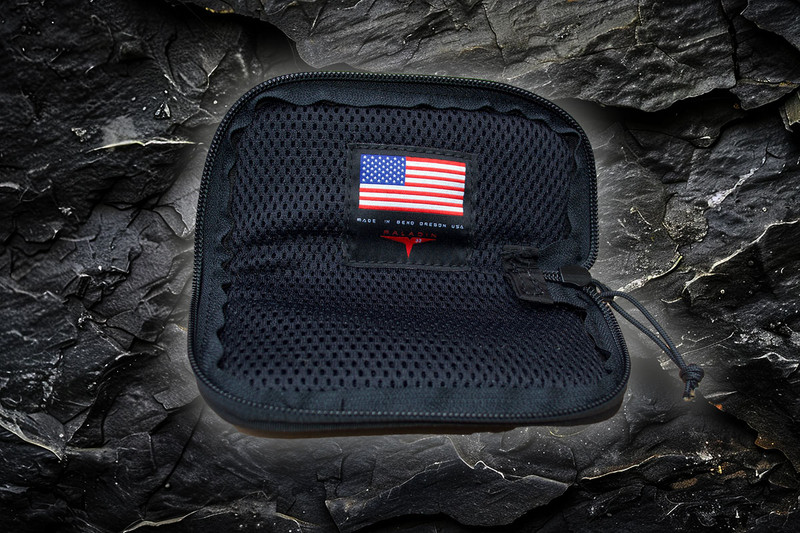 Close-up of the Spartan Blades Pattern Knife Pouch, showcasing a bold yellow Spartan Blades pattern on durable Cordura Nylon. The pouch is padded for added protection and features a sturdy YKK zipper and reinforced edges, highlighting its quality craftsmanship.