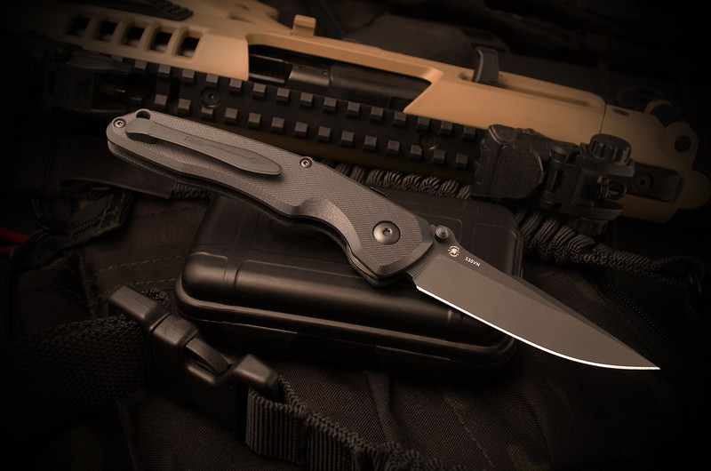 Spartan Blades Soter Blackout Edition folding knife, presentation side view with black CPM S35VN spear point blade and textured black G10 handle