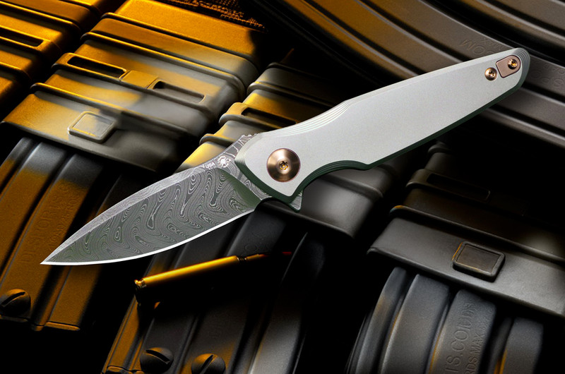 Presentation-side view of the Spartan Blades Pandia folding knife with 6AL4V titanium frame, bronze anodized titanium hardware, spear-point Chad Nichols Damascus blade, flipper tab, and clean minimalist handle profile