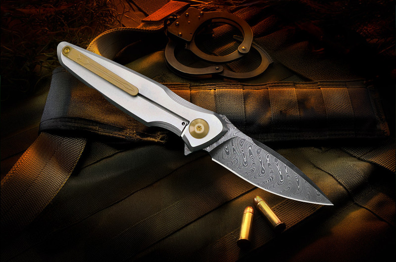 Lock-side view of the Spartan Blades Pandia titanium frame-lock flipper showing the monolithic titanium pocket clip, bronze anodized hardware accents, frame-lock bar, and spear-point Chad Nichols Damascus blade.