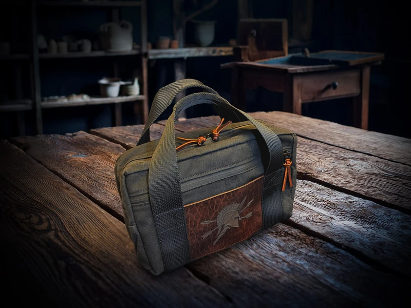 Spartan Blades Chattanooga Leatherworks waxed canvas tool bag with embossed Spartan Blades leather front panel and zippered side pockets.