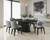 large black dining table set with upholstered chairs