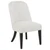 Contemporary cream upholstered dining side chair with padded seat, channel-tufted back and black legs, angled view