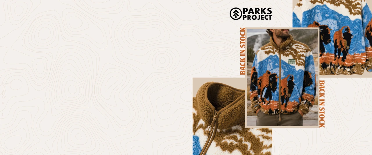 Parks Project | Back In Stock | Man in Parks Project exclusive fleece jacket with buffalo on topographic style beige background.