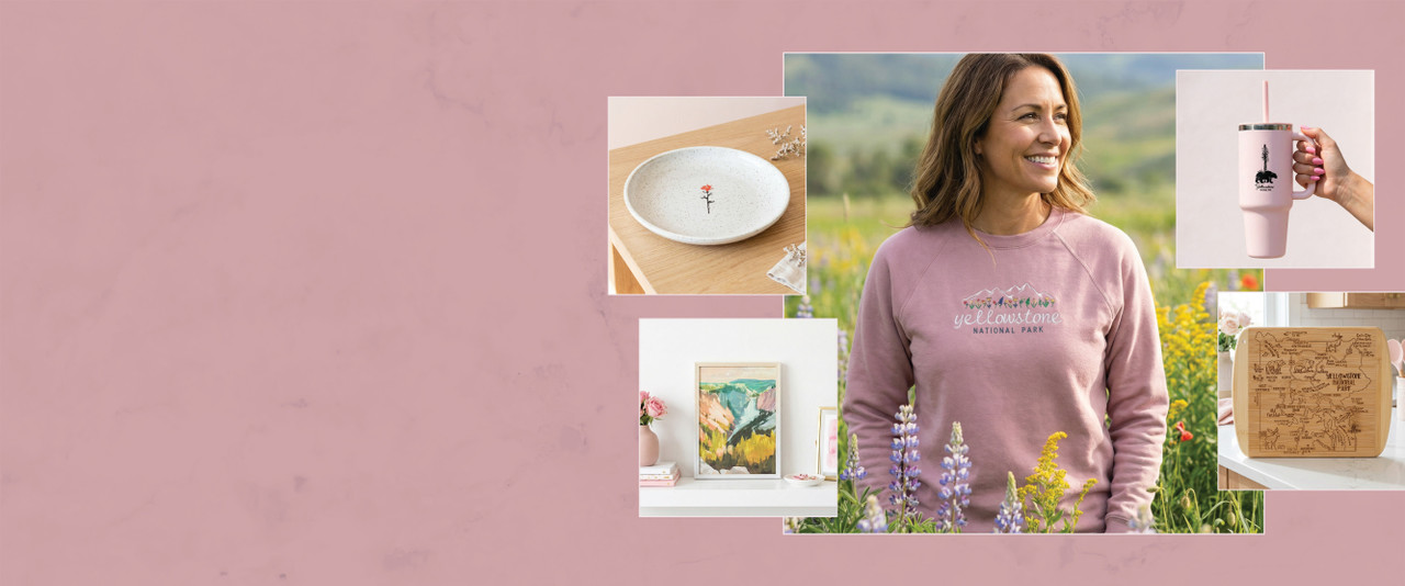 Woman in pink Yellowstone sweatshirt, plate, cup, cutting board, and Yellowstone print all on a pink background.