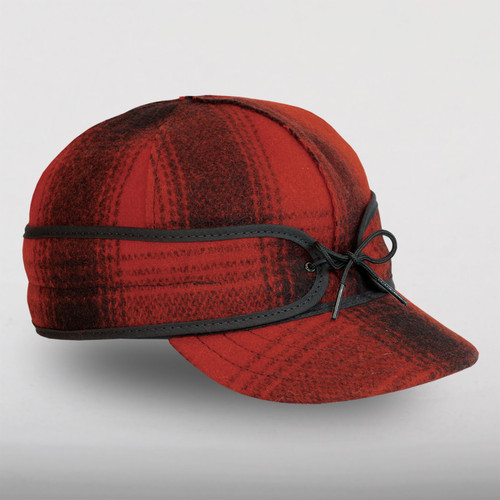 The Original Stormy Kromer Cap: a wool, six-panel winter cap with a pulldown earband, brim and tie in the front.