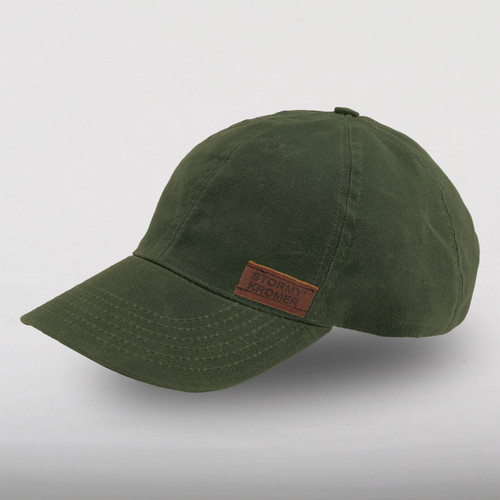 45 degree angle view of the Waxed Cotton Curveball Cap: A traditional baseball cap made in solid waxed cotton fabric with a leather Stormy Kromer logo patch on the front.