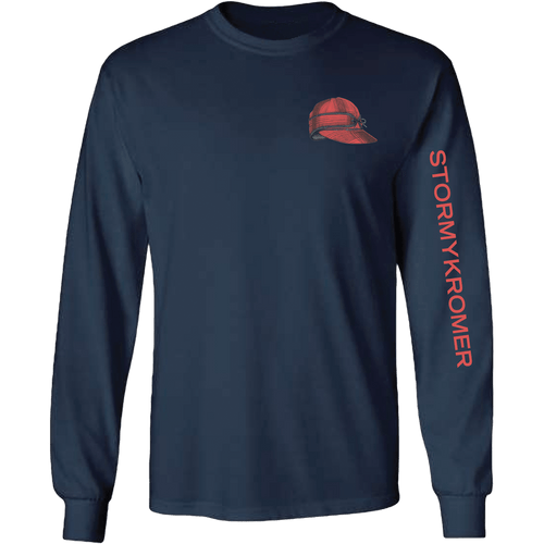 Front view of a navy long sleeve tee shirt with a red Stormy Kromer cap print on the left chest and the words STORMY KROMER in red down the left sleeve. Front view of a navy long sleeve tee shirt with a red Stormy Kromer cap print on the left chest and the words STORMY KROMER in red down the left sleeve.