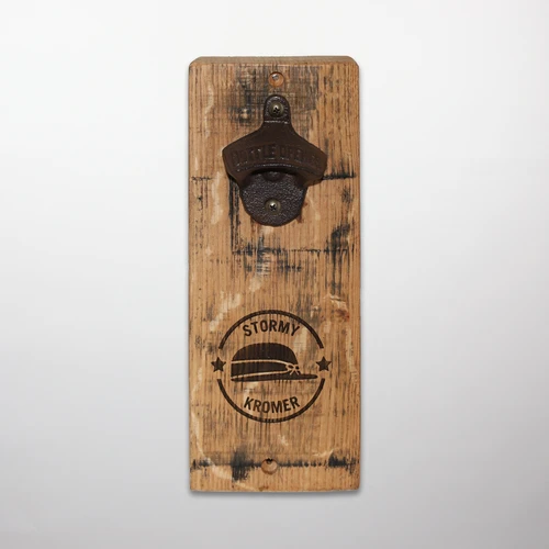 Rustic, wall-mounted, wood stave bottle opener with a Stormy Kromer graphic burned into the wood