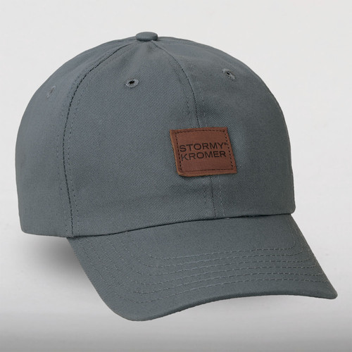 Our blue gray twill ballcap with a leather patch on the front with Stormy Kromer embossed.