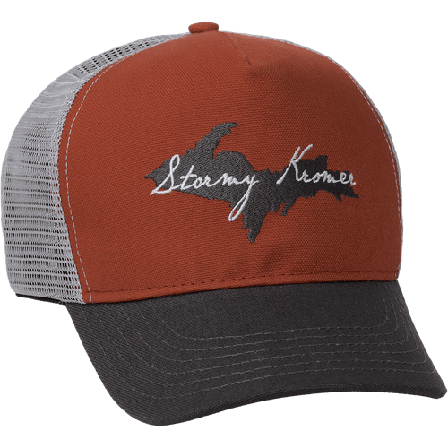 The Homegrown Trucker with a rust colored front, light gray back, dark gray brim with an embroidery of the upper peninsula of Michigan in dark gray and Stormy Kromer in white. The Homegrown Trucker with a rust colored front, light gray back, dark gray brim with an embroidery of the upper peninsula of Michigan in dark gray and Stormy Kromer in white.