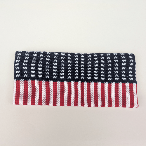 Knit headband with a red, white, and blue American flag design.