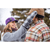 A man and woman outside in winter, with woman adjust the man's cap. Woman is wearing a plum Button Up Cap, gray shirt and gray plaid mittens. Man is wearing a sand Stormy Kromer cap and a plaid shirt.