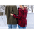 Woman with her arm around a man looking at the snow.