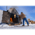 Man filling the outdoor wood burner in the winter.