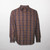 A traditional plaid cotton flannel shirt with a button front and left chest pocket.