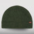 Image of a fleece knit beanie-style laid down flat. There is a Stormy Kromer logo label on the center front.