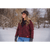 A woman wearing the Lighthouse Jacket in Garnet outside in the winter.