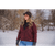 A woman wearing the Lighthouse Jacket in Garnet outside in the winter.