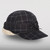 The Equinox Cap in Plymouth plaid with a white sherpa earband.
