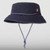 Our navy Breakwater hat - a bucket-style hat with wide brim and paracord neck strap with cord lock