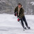 Young man wearing a Wool Overshirt in olive and hoodie playing hockey