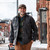 Man walking downtown in the winter wearing a gray Wool Overshirt and cap