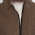 The Squall coat in Dark Oak waxed cotton close up of zipper.