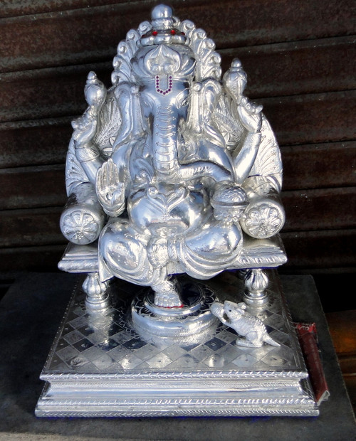 pure silver Ganesha with wooden base
