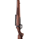 Side angle view of the Spandu RL .308 rifle with walnut stock